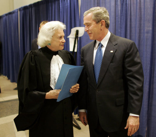 President George W. Bush and Supreme Court Justice Sandra Day O’Connor share a moment backstage March 3, 2005, prior to the swearing-in ceremonies for Michael Chertoff as secretary of Homeland Security. In response to the Justice’s resignation, President Bush called her one of the most admired women of her time and said he was proud to know her. File photo. White House photo by Paul Morse