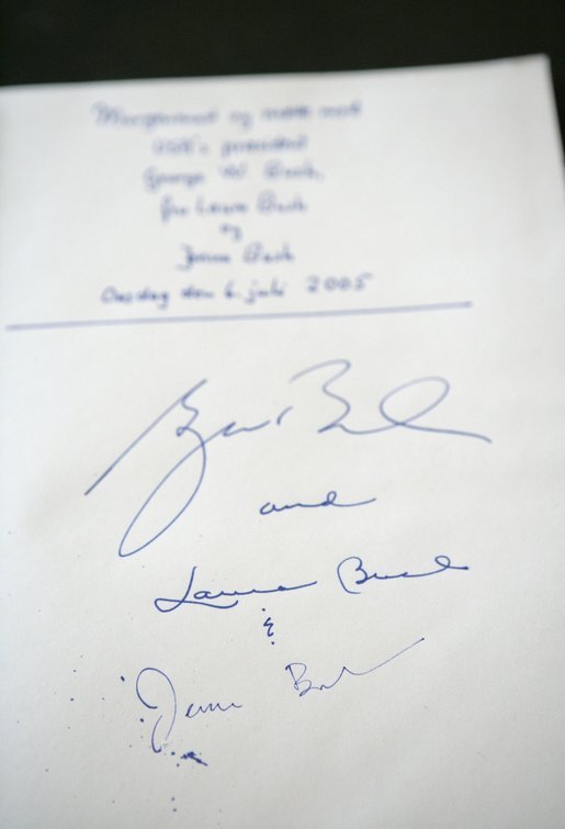 The signatures of President Bush and Laura Bush are written in the guest book at Prime Minister Anders Fogh Rasmussen's summer residence in Marienborg in Kongens Lyngby, Denmark, Wednesday, July 6, 2005. White House photo by Eric Draper