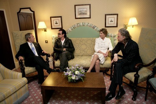 President George W. Bush, Bono, Laura Bush and Bob Geldof, far right, hold a working meeting on Africa at the G8 Summit in Gleneagles, Scotland, Wednesday, July 6, 2005. White House photo by Eric Draper