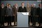 President George W. Bush and fellow G8 leaders stand behind England's Prime Minister Tony Blair Thursday, July 7, 2005, as he addressed the media at the Gleneagles Hotel in Auchterarder, Scotland, regarding the terrorist attacks that occured in London earlier in the day. White House photo by Eric Draper