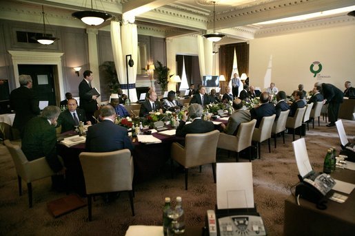 G8 leaders gather around the table for a morning session at the Gleneagles Hotel in Auchterarder, Scotland. The summit ended Friday, July 8, 2005. White House photo by Eric Draper