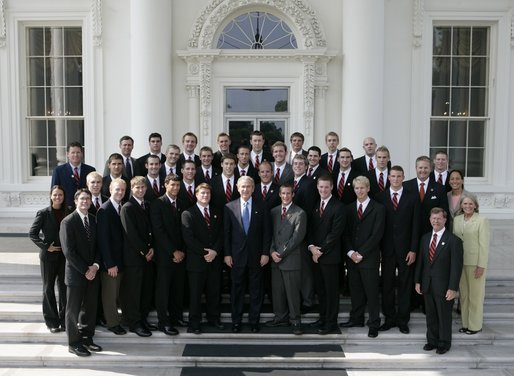 President George W. Bush stands with members of the Auburn University Men's Swimming and Diving team during Championship Day at the White House Tuesday, July 12, 2005. White House photo by Eric Draper