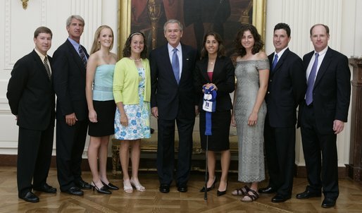 President George W. Bush stands with members of the Duke University Women's Golf team during Championship Day at the White House Tuesday, July 12, 2005. White House photo by David Bohrer