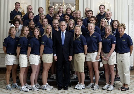 President George W. Bush stands with members of the University of Michigan Women's Softball team Tuesday, July 12, 2005, during Championship Day at the White House. White House photo by David Bohrer