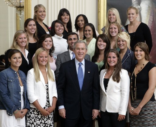 George W. Bush stands with members of the UCLA Women's Water Polo team Tuesday, July 12, 2005, during Championship Day at the White House. White House photo by David Bohrer