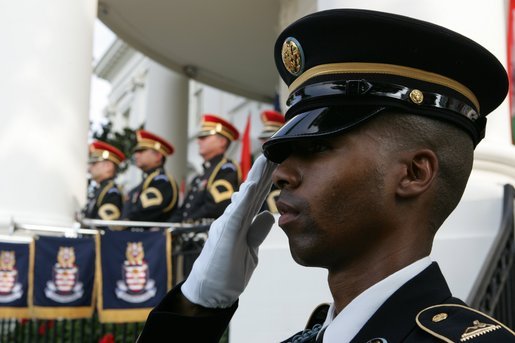 A member of the 3rd U.S. Infantry Old Guard Ceremonial Unit salutes Monday, July 18, 2005, at the arrival ceremony for India's Prime Minister Dr. Manmohan Singh, on the South Lawn of the White House. White House photo by David Bohrer