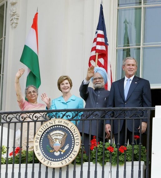 President Bush stands with India's Prime Minister Dr. Manmohan Singh, Laura Bush and Singh's wife, Mrs. Gursharan Kaur, Monday, July 18, 2005 during the Prime Minister's official visit to the White House. White House photo by David Bohrer