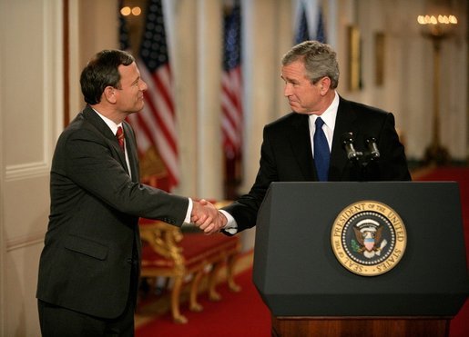 President George W. Bush shakes hands with his Supreme Court Justice Nominee John Roberts after his remarks on the State Floor of the White House, Tuesday evening, July 19, 2005. White House photo by Eric Draper