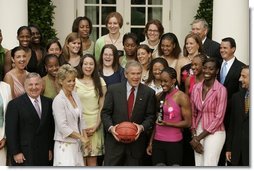 President George W. Bush and members of Baylor University's Lady Bears NCAA basketball team erupt in laughter Wednesday, July 20, 2005, during their Rose Garden visit at the White House.  White House photo by Paul Morse