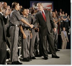 President George W. Bush meets Maryland Transportation Authority police officers, following his address to an audience Wednesday, July 20, 2005 at the Port of Baltimore in Baltimore, Md., where he encouraged renewal of Patriot Act provisions.  White House photo by Eric Draper