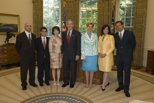 President George W. Bush welcomes representatives from the Colombian-American community and the government of Colombia into the Oval Office Wednesday, July 20, 2005, to commemorate Colombia's Independence Day. From left are: Augusto D'Avila, a veteran of Operation Iraqi Freedom; Colombia Ambassador Luis Alberto Moreno and his wife, Gabriela Fedres-Cordero; President Bush, Carolino Barco, Foreign Affairs Minister of Colombia; Gloria Haskins, R-S.C., and actor Paulo Benedeti. White House photo by Paul Morse