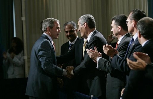 President George W. Bush greets audience members at the Hispanic Alliance for Free Trade, Thursday, July 21, 2005, at the Organization of American States in Washington. President Bush thanked the group for their support of CAFTA. White House photo by Eric Draper