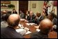 President George W. Bush meets with African American leaders Monday, July 25, 2005, in the Roosevelt Room of the White House to discuss key issues and to announce the corporate and philanthropic summit to be held in March 2006. White House photo by Krisanne Johnson