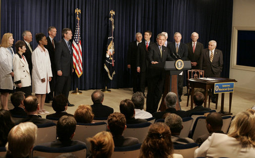 President George W. Bush, seen with members of the U.S. Senate and patient advocates, addresses an audience following his sigining of the Patient Safety and Quality Improvement Act of 2005, at a ceremony Friday, July 29, 2005 in the Eisenhower Executive Office Building in Washington, D.C. White House photo by Krisanne Johnson