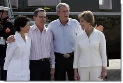 President George W. Bush and Colombian President Alvaro Uribe pose with their wives, U.S. first lady Laura Bush (R) and Colombia first lady Lina Moreno at the President's Central Texas ranch in Crawford, Texas, on August 4, 2005.  White House photo by Paul Morse