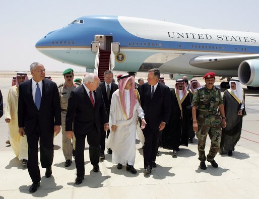 Vice President Dick Cheney, former Secretary of State Colin Powell, and former President George H.W. Bush are escorted from the plane by members of the Saudi delegation before meeting with the newly crowned King Abdullah of Saudi Arabia Friday, August 05, 2005. Vice President Dick Cheney led a delegation to pay respects following the recent death of King Fahd. White House photo by David Bohrer