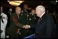 Vice President Dick Cheney shakes the hand of Sgt. Justin Genovese, US Marine Corps, who was wounded in battle in Iraq, August 4, 2004. The vice president spoke to he and other the attendees at the 73rd National Convention of the Military Order of the Purple Heart in Springfield, Missourri, Thursday, August 18, 2005. The organization was formed in 1932 for the protection and mutual interest of all who have, as a result of being wounded in combat, recieved the Purple Heart. White House photo by David Bohrer