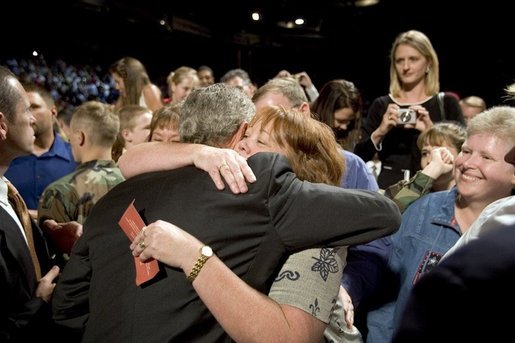 The mother of four sons currently deployed to Iraq, Tammy Pruett, is embraced by President George W. Bush following his speech at Idaho Center Arena, Wednesday, Aug. 24, 2005 in Nampa, Idaho, honoring the service of National Guard and Reserve troops serving in Afghanistan and Iraq. White House photo by Paul Morse