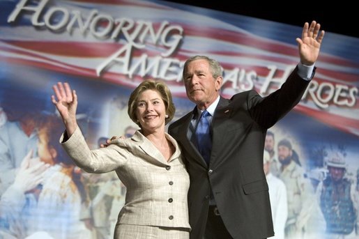 President George W. Bush and Laura Bush wave to the crowd of military families, Wednesday, Aug. 24, 2005 at the Idaho Center Arena in Nampa, Idaho, following the President's speech honoring the service of National Guard and Reserve forces serving in Afghanistan and Iraq. White House photo by Paul Morse