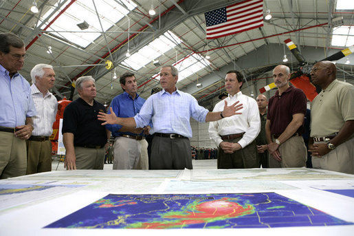 President George W. Bush talks about Hurricane Katrina disaster relief with, from left: Senator Trent Lott, R-Miss.; Senator Thad Cochran, R-Miss.; Mississippi Governor Haley Barbour; Alabama Governor Bob Riley; FEMA Director Mike Brown; Michael Chertoff, Secretary of Homeland Security, and Alphonso Jackson, Secretary of Housing and Urban Development. The President briefed the officials during his tour Friday, Sept. 2, 2005, of the Gulf Coast regions hard hit by the storm. White House photo by Eric Draper