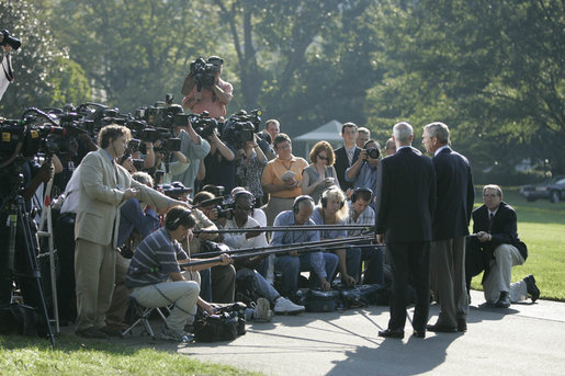 President George W. Bush and Michael Chertoff, Secretary of Homeland Security, talk with the media Friday, Sept. 2, 2005, on the South Lawn of the White House. The President briefed the press on hurricane disaster relief before departing for a tour of the Gulf Coast area hit by Hurricane Katrina. White House photo by Paul Morse