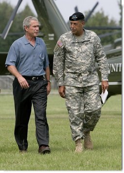 President George W. Bush and U.S. Army Lt General Russel Honore walk to the Emergency Operations Center, Monday, Sept. 5, 2005, after the President's arrival in Baton Rouge, La.  White House photo by Eric Draper