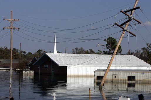 A church in New Orleans, Louisiana is submerged by floodwaters that were caused by the effects of Hurricane Katrina Thursday, September 8, 2005. The hurricane hit both Louisiana and Mississippi on August 29th. White House photo by David Bohrer