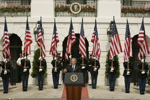 President George W. Bush gestures as he addresses guests on the South Lawn of the White House, Friday, Sept. 9, 2005, during the 9/11 Heroes Medal of Valor Award Ceremony and to honor the courage and commitment of emergency services personnel who died on Sept. 11, 2001. White House photo by Paul Morse