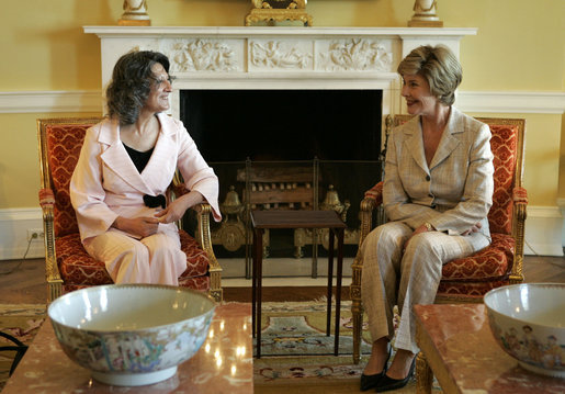 Laura Bush visits with Mrs. Hero Ibrahim Ahmed, wife of Iraqi President Jalal Talabani, during a tea in the private residence of the White House Monday, Sept. 12, 2005. White House photo by Krisanne Johnson
