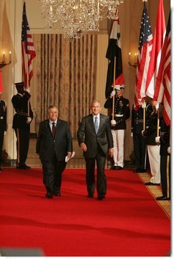 President George W. Bush and President Jalal Talabani of Iraq walk to the East Room of the White House Tuesday, Sept. 13, 2005, for a joint press availability. The President called Iraq "America's ally in the war against terrorism," and added, "freedom will win in Iraq."  White House photo by Shealah Craighead