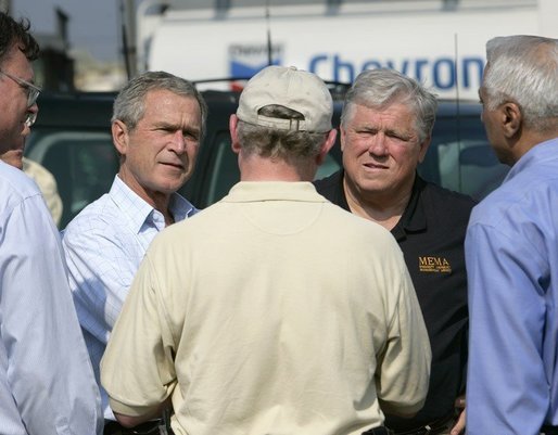 President George W. Bush receives a briefing from Chevron Refinery Manager Roland Kell with Mississippi Governor Haley Barbour at the Chevron Pascagoula Refinery in Mississippi, Thursday, Sept. 15, 2005. White House photo by Eric Draper