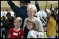 Lynne Cheney poses for photos with children at George Washington's Mount Vernon Estate, Friday, Sept. 16, 2005 in Mount Vernon, Va., during the Constitution Day 2005: Telling America's Story event. White House photo by Shealah Craighead
