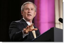 President George W. Bush gestures as he addresses an audience, Wednesday, Sept. 21, 2005 at the Republican Jewish Coalition's 20th Anniversary Celebration in Washington.  White House photo by Paul Morse