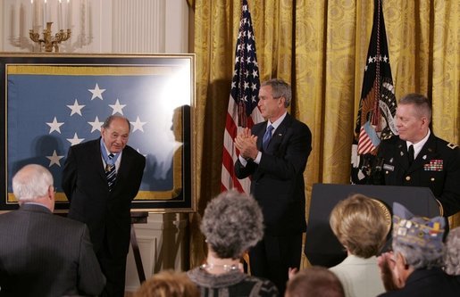 Korean War era veteran Corporal Tibor "Ted" Rubin, receives a standing ovation, after being presented the Medal of Honor by President George W. Bush, Friday, Sept. 23, 2005 at cermonies at the White House in Washington. Rubin was honored for his actions under fire, and his bravery while in captivity at a Chinese POW camp. White House photo by Krisanne Johnson