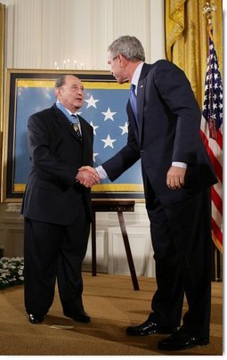 President George W. Bush congratulates Korean War era veteran Corporal Tibor " Ted" Rubin, after awarding Rubin the Medal of Honor, Friday, Sept. 23, 2005 at cermonies at the White House in Washington. Rubin was honored for his actions under fire, and his bravery while in captivity at a Chinese POW camp.  White House photo by Paul Morse