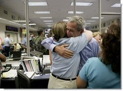 President George W. Bush hugs a worker while visiting with emergency personnel inside the Texas Emergency Operations Center in Austin, Texas, Saturday, Sept. 24, 2005. White House photo by Eric Draper