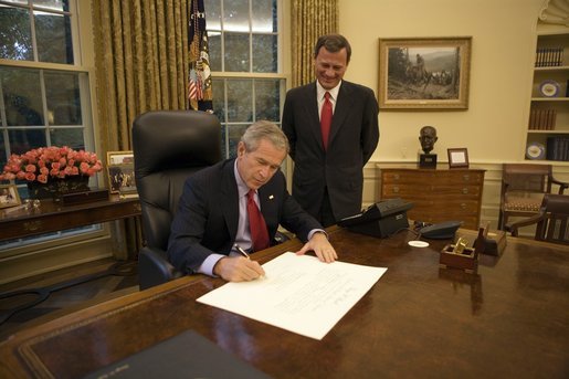 President George W. Bush signs the commission appointing John Roberts as the 17th Chief Justice of the United States prior to swearing-in ceremonies Thursday, Sept. 29, 2005, at the White House. White House photo by Eric Draper
