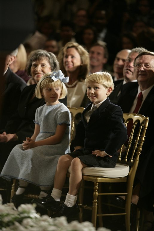 Jack and Josie Roberts look on as their father, John G. Roberts Jr., takes the Oath of Office as the 17th Chief Justice of the United States during ceremonies Thursday, Sept. 29, 2005, at the White House. White House photo by Eric Draper