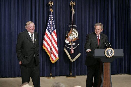 President George W. Bush appears on stage, Thursday, Oct. 6, 2005 at the Eisenhower Executive Office Building in Washington, with William F. Buckley, Jr., to honor the 50th anniversary of National Review magazine, which was founded by Buckley, and to recognize Buckley's upcoming 80th birthday. White House photo by Paul Morse
