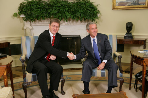 President George W. Bush and Prime Minister Ferenc Gyurcsany of Hungary shake hands during a photo opportunity in the Oval Office of the White House Friday, Oct. 7, 2005. The President told the media he appreciated the Prime Minister's understanding of the "importance of democracy and freedom," and thanked him for his leadership. White House photo by Paul Morse