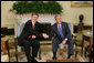 President George W. Bush and Prime Minister Ferenc Gyurcsany of Hungary shake hands during a photo opportunity in the Oval Office of the White House Friday, Oct. 7, 2005. The President told the media he appreciated the Prime Minister's understanding of the "importance of democracy and freedom," and thanked him for his leadership. White House photo by Paul Morse