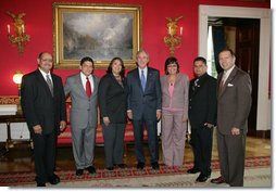 President George W. Bush poses for a photo in the Red Room of the White House, Friday, Oct. 7, 2005, with recipients of the President's Volunteer Service Awards, honored in celebration of Hispanic Heritage Month. From left to right with President Bush are John Diaz of Crowley, Colo., Manuel Fonseca of Nashville, Tenn., Marie Arcos of Houston Texas, Maria Hines of Albuquerque, N.M., Eleuterio "Junior" Salazar of Bradenton, Fla. and Dr. Elmer Carreno of Silver Spring, Md.  White House photo by Shealah Craighead