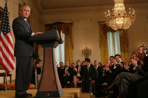 President George W. Bush is applauded in the East Room of the White House, Friday, Oct. 7, 2005, as he offers remarks in celebration of Hispanic Heritage Month. President Bush also honored recipients of the President's Volunteer Service Awards at the event. White House photo by Shealah Craighead