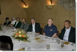 President George W. Bush, center, is seen Monday evening, Oct. 10, 2005 at the restaurant Bacco in New Orleans, La., sitting next to U. S. Coast Guard Vice Admiral Thad W. Allen, New Orleans Mayor Ray Nagin and joined by other local officials.  White House photo by Eric Draper