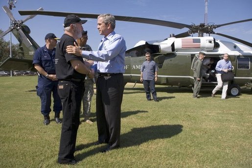 President George W. Bush is greeted by Jefferson Parish president Aaron Broussard upon his arrival Tuesday, Oct. 11, 2005 to New Orleans aboard Marine One. White House photo by Eric Draper