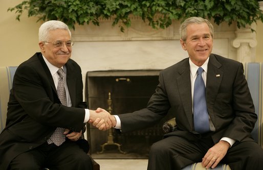 President George W. Bush welcomes Mahmoud Abbas, President of the Palestinian Authority, to the Oval Office Thursday, Oct. 20, 2005. White House photo by Eric Draper