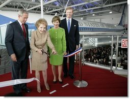 President George W. Bush and Laura Bush join Nancy Reagan, Friday, Oct. 21, 2005, as she cuts the ribbon to officially open the Air Force One Pavilion at the Ronald Reagan Library in Simi Valley, Calif., featuring the Boeing 707 aircraft that served President Ronald Reagan and six other presidents. Fred Ryan Jr. of the Ronald Reagan Presidential Foundation is seen at right.  White House photo by Eric Draper