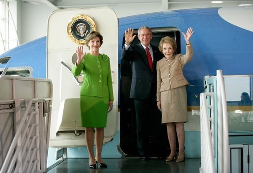 President George W. Bush, Laura Bush and Nancy Reagan wave after touring the plane that served as Air Force One for President Ronald Reagan and six other Presidents from 1973-2001at the Ronald Reagan Presidential Library in Simi Valley, California, Friday, Oct. 21, 2005. White House photo by Eric Draper