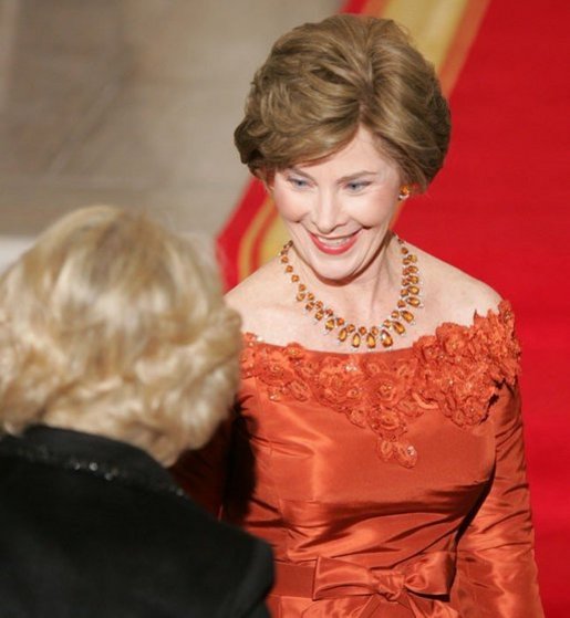 Laura Bush welcomes the Duchess of Cornwall upon the arrival of the Prince of Wales and the Duchess to the White House, Wednesday evening, Nov. 2, 2005. White House photo by Paul Morse