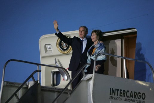 President George W. Bush and Laura Bush wave from Air Force One after landing Thursday, Nov. 3, 2005, in Mar del Plata, Argentina, where the President will participate in the Summit of the Americas. White House photo by Krisanne Johnson